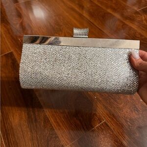 Elegant Silver Clutch Bag with Attachable Chain